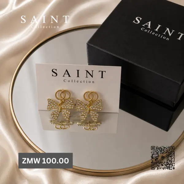 Crystal bow earrings on a Saint Collection card